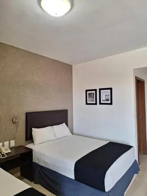 Cama o camas de una habitación en Hotel Ruiz Milán