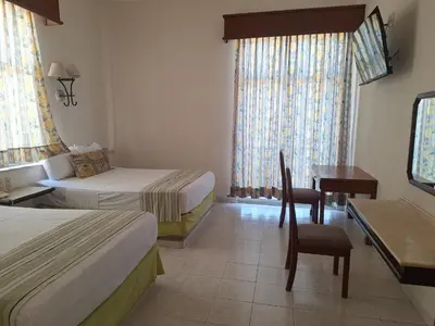 Cama o camas de una habitación en Hotel Ruiz Milán