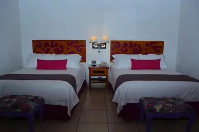 Cama o camas de una habitación en Boutique Pueblo Lindo