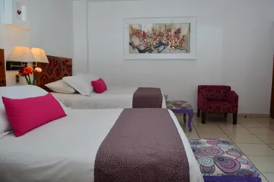 Cama o camas de una habitación en Boutique Pueblo Lindo