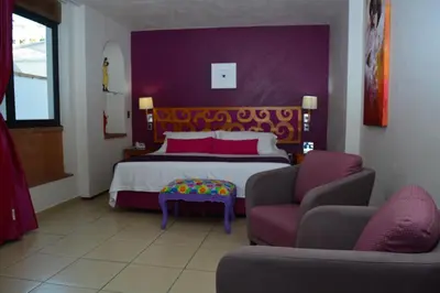 Cama o camas de una habitación en Boutique Pueblo Lindo