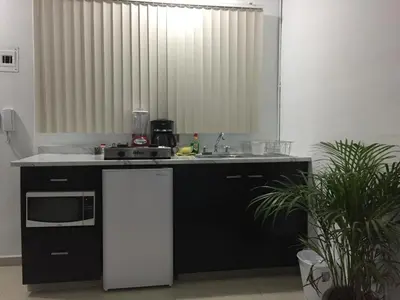 Una cocina o zona de cocina en Habitaciones amuebladas Veracruz Logos