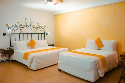 Cama o camas de una habitación en Hotel Oaxaca Real