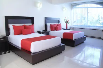 Cama o camas de una habitación en Villa Las Margaritas Caxa