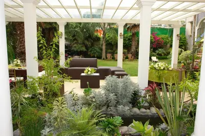 Jardín al aire libre en Villa Las Margaritas Caxa