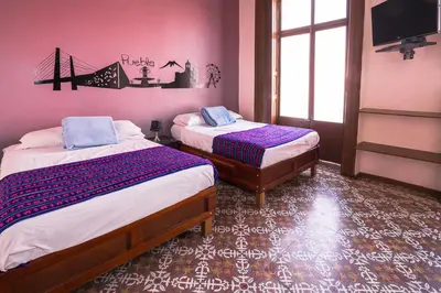 Cama o camas de una habitación en Hostal Santo Domingo