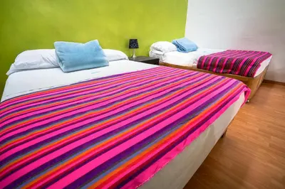 Cama o camas de una habitación en Hostal Santo Domingo
