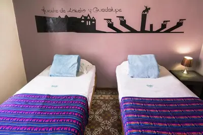 Cama o camas de una habitación en Hostal Santo Domingo