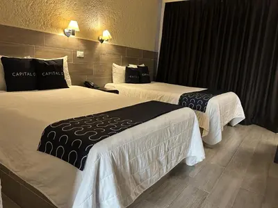 Cama o camas de una habitación en Hotel Del Portal, Puebla