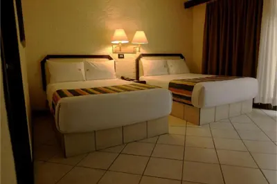 Cama o camas de una habitación en Hotel Del Portal, Puebla