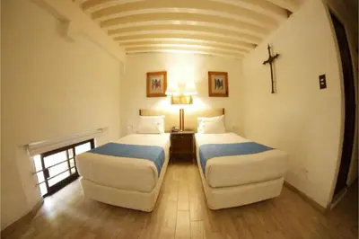 Cama o camas de una habitación en Hotel Del Portal, Puebla