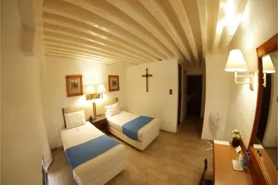 Cama o camas de una habitación en Hotel Del Portal, Puebla