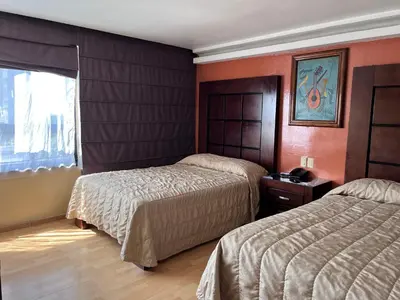 Cama o camas de una habitación en Hotel Gilfer Puebla Centro Histórico