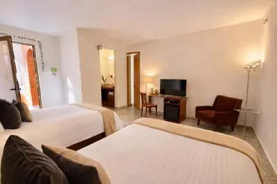 Cama o camas de una habitación en El Sueño Hotel & Spa