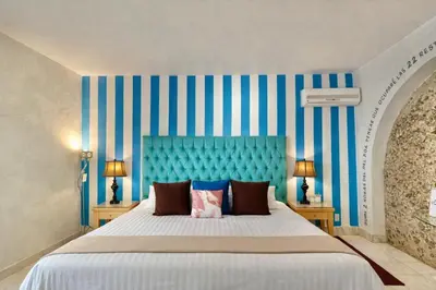 Cama o camas de una habitación en El Sueño Hotel & Spa