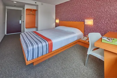 Cama o camas de una habitación en City Express Junior by Marriott Tuxtla Gutierrez Poliforum