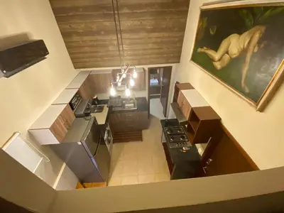 Una televisión o centro de entretenimiento en Loft Frente a la Playa!!!!
