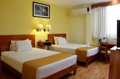 Cama o camas de una habitación en Hotel Madan Cárdenas