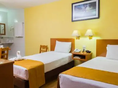 Cama o camas de una habitación en Hotel Madan Cárdenas