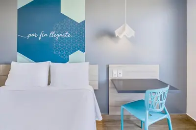 Cama o camas de una habitación en One Puebla Angelopolis Periferico