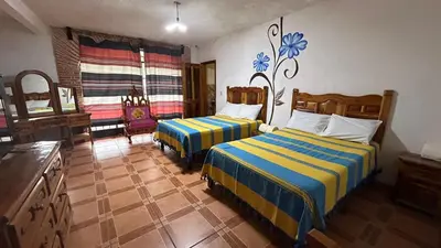 Cama o camas de una habitación en Hotel Colonial Taxco