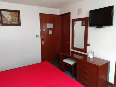 Cama o camas de una habitación en Hotel Maria Victoria Xalapa