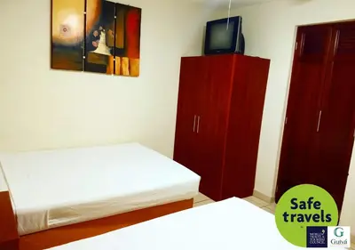 Cama o camas de una habitación en Hotel Guivá Huatulco