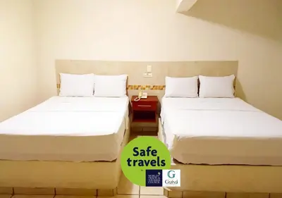 Cama o camas de una habitación en Hotel Guivá Huatulco