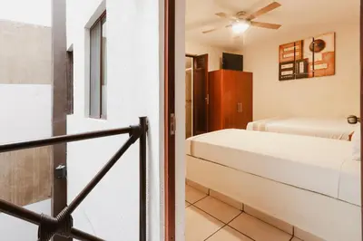 Cama o camas de una habitación en Hotel Guivá Huatulco