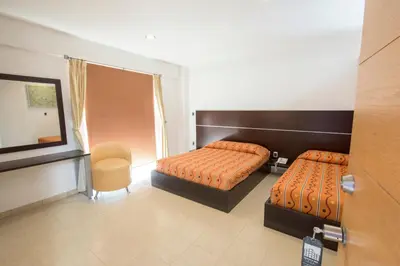 Cama o camas de una habitación en Hotel Oaxaca Inn Express