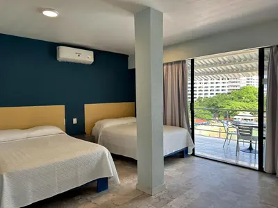 Cama o camas de una habitación en Acamar Beach Resort