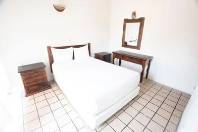 Cama o camas de una habitación en Villas del Sol Hotel & Bungalows