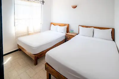 Cama o camas de una habitación en Villas del Sol Hotel & Bungalows
