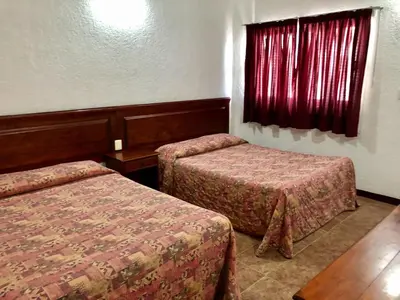 Cama o camas de una habitación en Hotel Roma