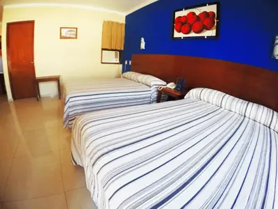 Cama o camas de una habitación en Hotel Oriente