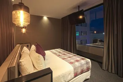 Cama o camas de una habitación en Kharma Suites