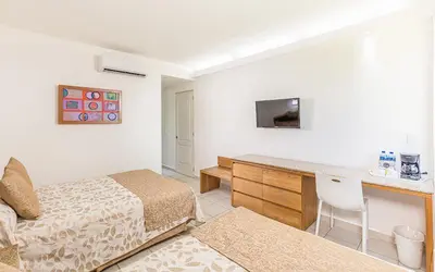 Cama o camas de una habitación en Posada Real Puerto Escondido