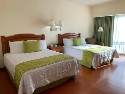 Cama o camas de una habitación en Hotel Villa Florida Puebla