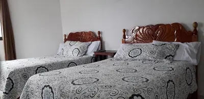 Cama o camas de una habitación en Hotel Posada Sernichari