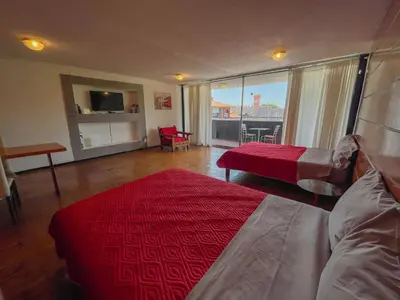 Cama o camas de una habitación en Suites Las Plazas