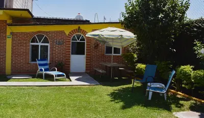 Jardín al aire libre en Hotel y Cabañas Quinta Los Cipreses