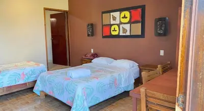 Cama o camas de una habitación en Hotel y Cabañas Quinta Los Cipreses