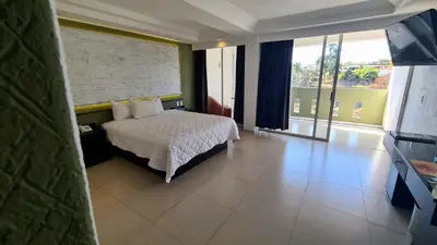 Cama o camas de una habitación en Hotel Borda Cuernavaca