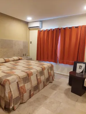 Cama o camas de una habitación en Hotel Parador del Rey