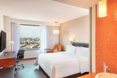 Cama o camas de una habitación en Fiesta Inn Express Puebla Explanada