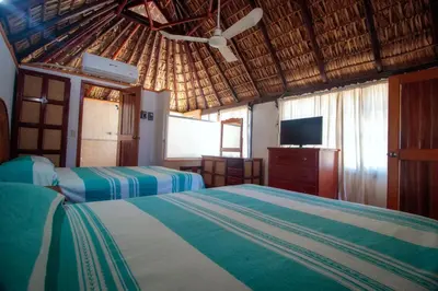 Cama o camas de una habitación en Hotel y Bungalows Acuario