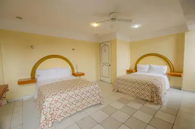 Cama o camas de una habitación en Hotel Central Puebla