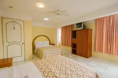 Cama o camas de una habitación en Hotel Central Puebla