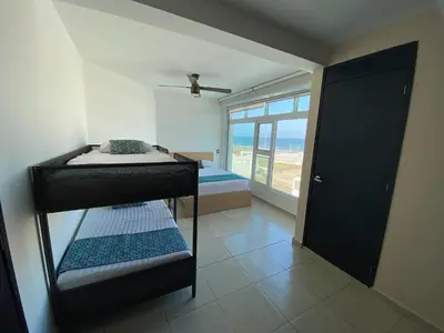 Cama o camas de una habitación en FRENTE PLAYA vista al mar, PISCINA DE USO EXCLUSIVO