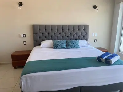 Cama o camas de una habitación en FRENTE PLAYA vista al mar, PISCINA DE USO EXCLUSIVO